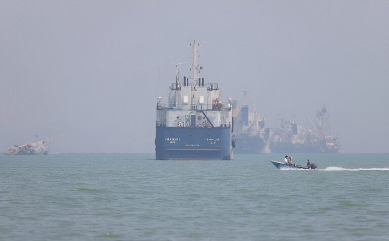 Amid intense military friction with the US, Iran has bypassed western blockades by opening direct negotiations with Oman for a new shipping lane.